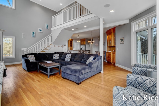 5575 Beechmont Rd, Whitehall, MI 49461 - living room with plenty of natural light, baseboards, stairs, and light wood-style floors