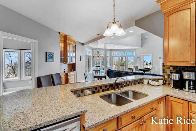 5575 Beechmont Rd, Whitehall, MI 49461 - kitchen featuring a sink, decorative light fixtures, a notable chandelier, light stone countertops, and recessed lighting