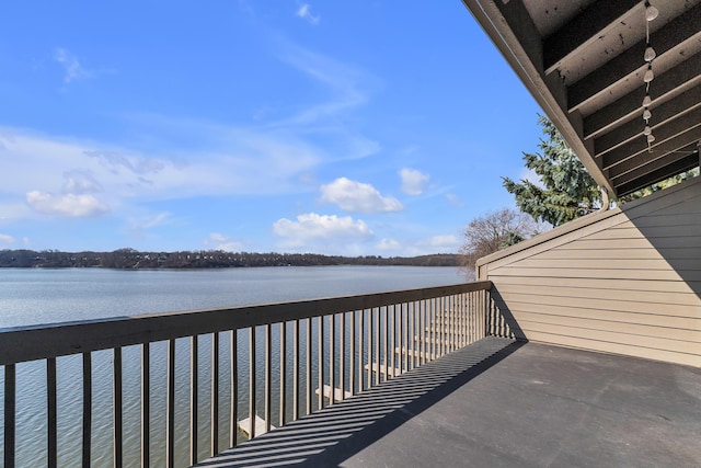 balcony featuring a water view