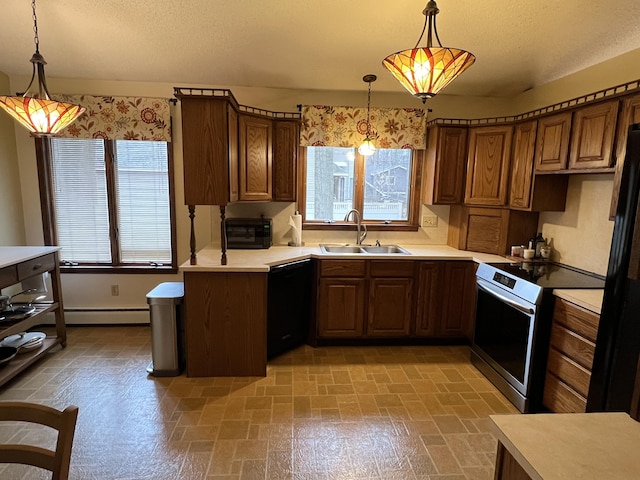 kitchen with plenty of natural light, light countertops, a sink, and black appliances