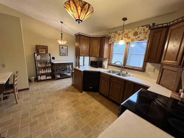 kitchen with brick patterned floor, light countertops, a sink, and black appliances
