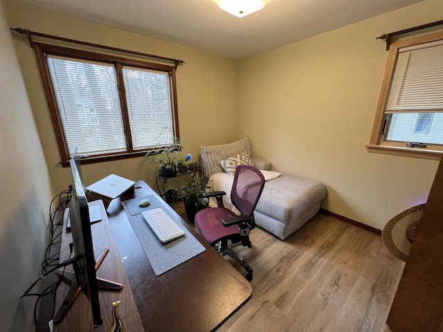 home office with wood finished floors and baseboards