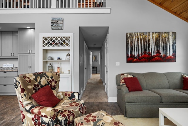 1219 Nokomis Dr, Gladwin, MI 48624 - living room with recessed lighting, wood finished floors, baseboards, and high vaulted ceiling
