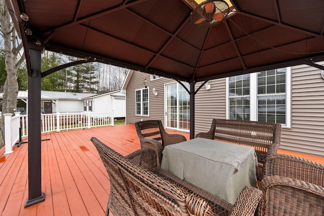 1219 Nokomis Dr, Gladwin, MI 48624 - wooden deck featuring a gazebo and a ceiling fan
