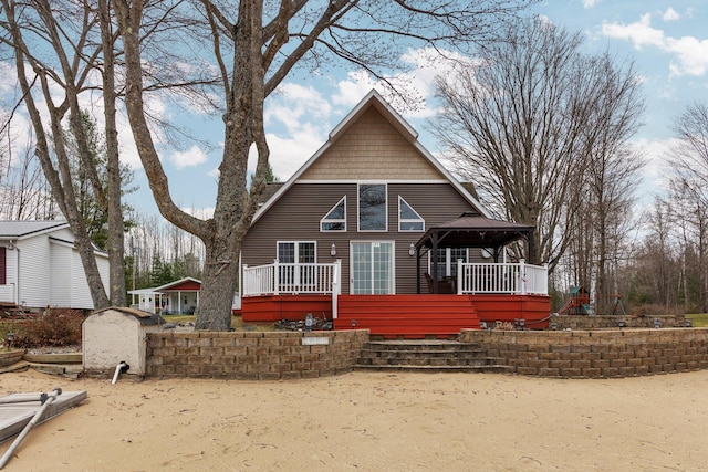 1219 Nokomis Dr, Gladwin, MI 48624 - view of front of house featuring a gazebo and a wooden deck
