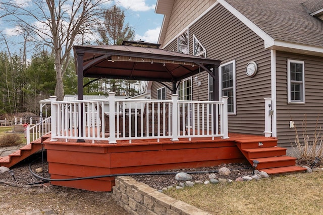 1219 Nokomis Dr, Gladwin, MI 48624 - deck with stairway and a gazebo