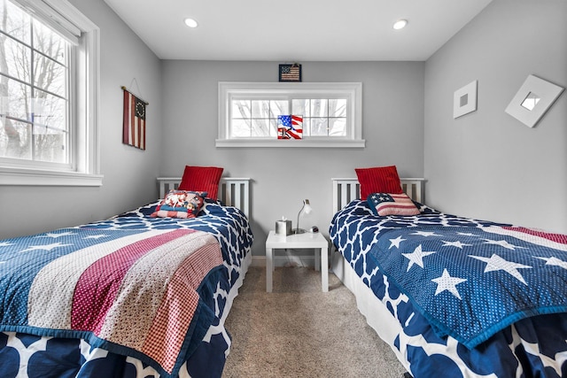 1219 Nokomis Dr, Gladwin, MI 48624 - carpeted bedroom with recessed lighting and multiple windows