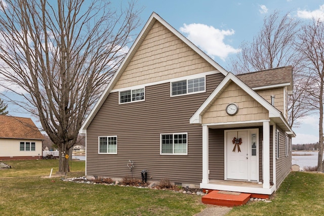 1219 Nokomis Dr, Gladwin, MI 48624 - exterior space featuring a yard, crawl space, and a shingled roof