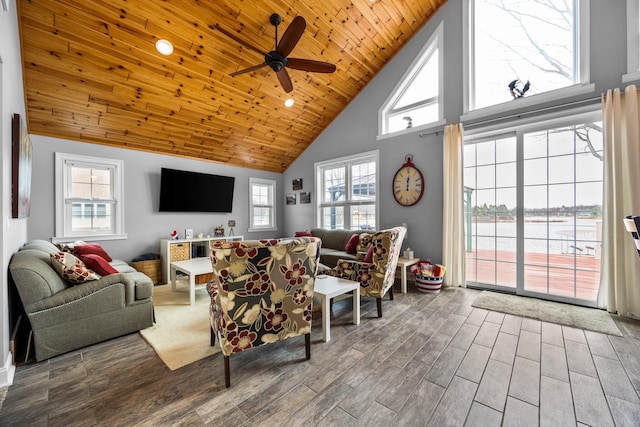 1219 Nokomis Dr, Gladwin, MI 48624 - living room featuring plenty of natural light, a ceiling fan, wood finished floors, and high vaulted ceiling