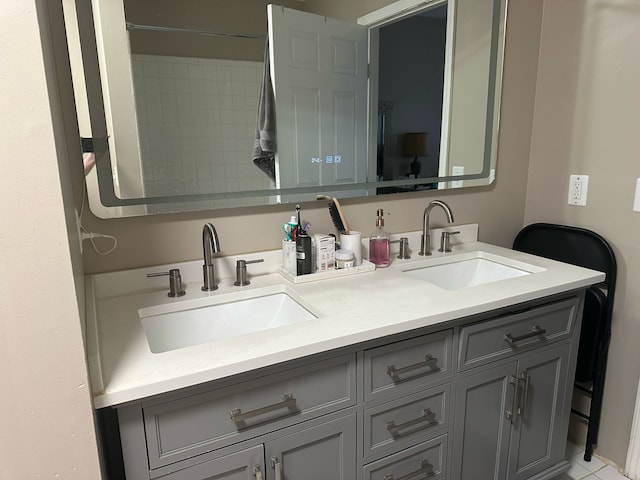 bathroom with a sink and double vanity