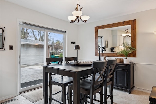 dining room with visible vents, a notable chandelier, and light tile patterned floors