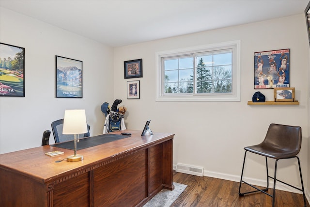 office area featuring visible vents, baseboards, and dark wood-style flooring