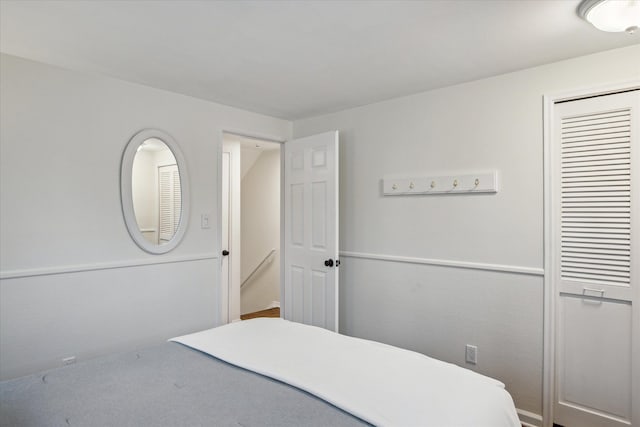 carpeted bedroom featuring a closet