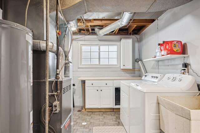 clothes washing area with cabinet space and washing machine and clothes dryer