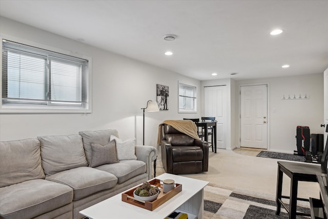 living room featuring recessed lighting and light colored carpet