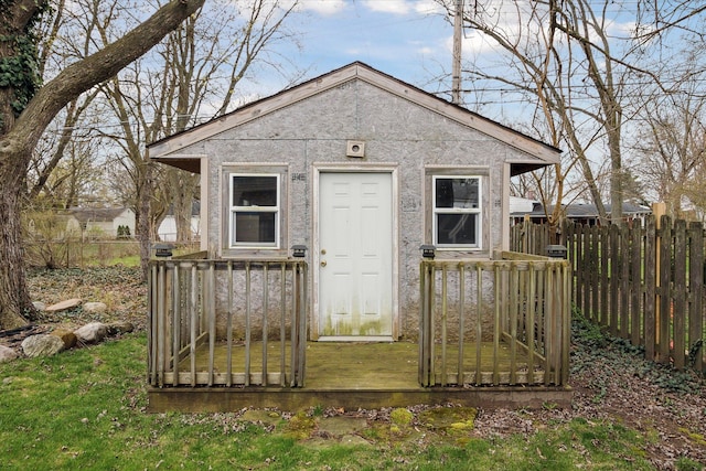 view of outbuilding with an outbuilding and fence