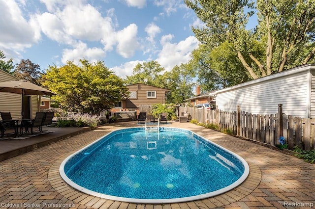 view of swimming pool with fence, a patio area, and a fenced in pool