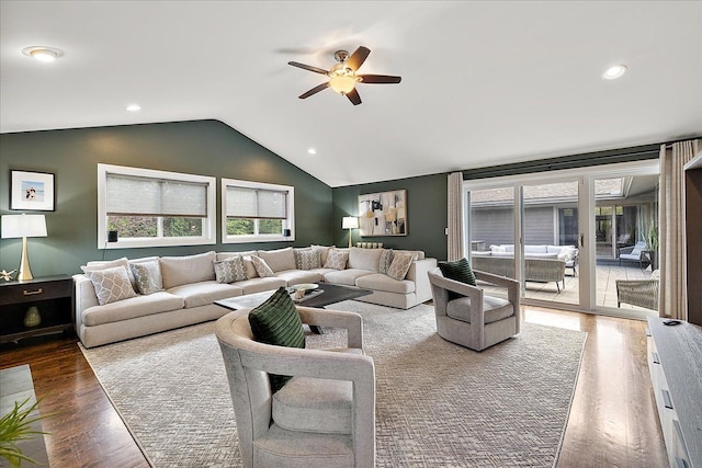 living room with lofted ceiling, a ceiling fan, wood finished floors, and recessed lighting