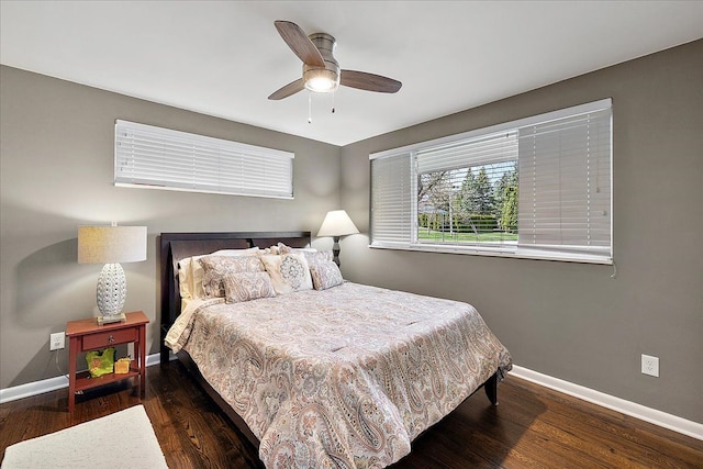 bedroom featuring wood finished floors, baseboards, and ceiling fan