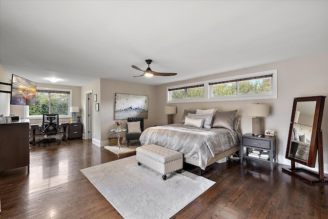 bedroom with baseboards, dark wood-style floors, and ceiling fan