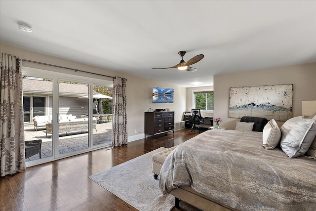 bedroom featuring baseboards, a ceiling fan, wood finished floors, and access to exterior