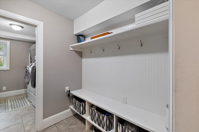 mudroom with baseboards and light tile patterned floors