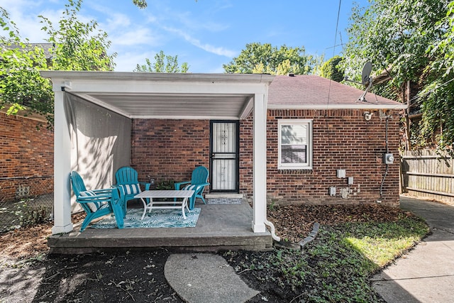 view of patio featuring fence
