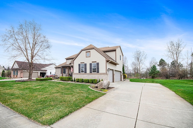 view of front of home featuring an attached garage, a front lawn, and driveway