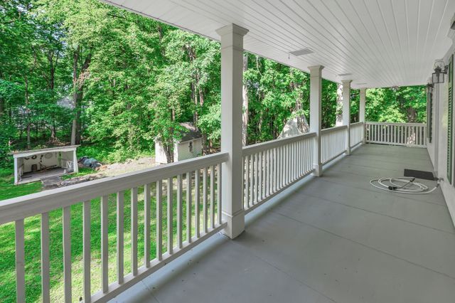 2457 Rocky Top Ln, Commerce Twp, MI 48382 - view of patio featuring covered porch