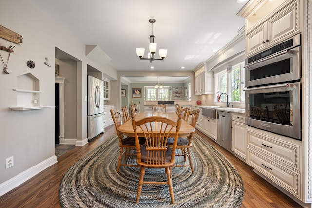 2457 Rocky Top Ln, Commerce Twp, MI 48382 - dining area with a chandelier, baseboards, dark wood-style floors, and recessed lighting