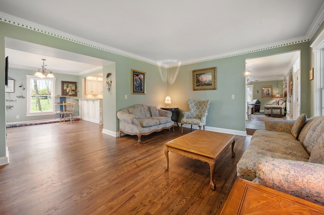 2457 Rocky Top Ln, Commerce Twp, MI 48382 - living room with dark wood-style floors, crown molding, baseboards, and a chandelier