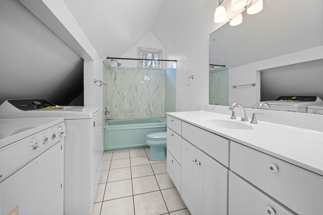 2457 Rocky Top Ln, Commerce Twp, MI 48382 - full bath with washer and dryer, lofted ceiling, tile patterned floors, shower / washtub combination, and vanity