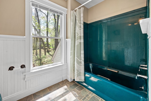 2457 Rocky Top Ln, Commerce Twp, MI 48382 - full bathroom featuring a wainscoted wall, shower / bath combo, and stone finish floors