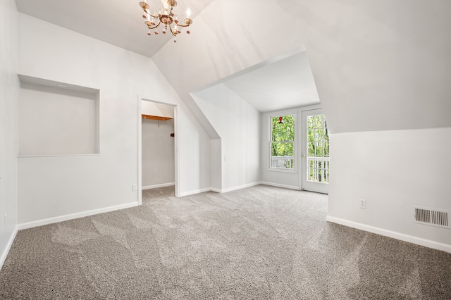 2457 Rocky Top Ln, Commerce Twp, MI 48382 - bonus room featuring vaulted ceiling, carpet floors, a chandelier, and baseboards