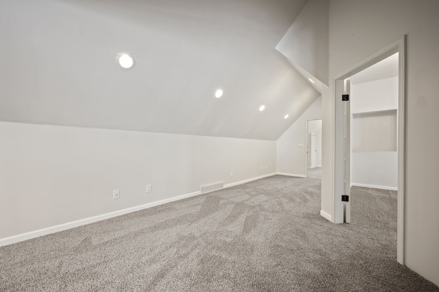 2457 Rocky Top Ln, Commerce Twp, MI 48382 - additional living space with carpet floors, vaulted ceiling, baseboards, and recessed lighting