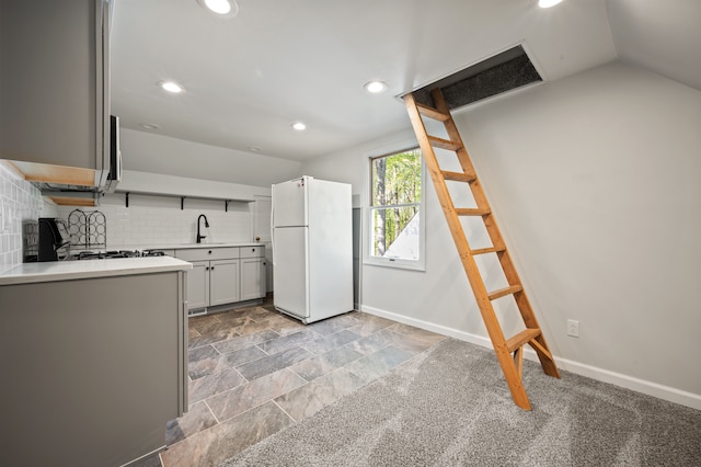 2457 Rocky Top Ln, Commerce Twp, MI 48382 - kitchen with freestanding refrigerator, recessed lighting, backsplash, light countertops, and baseboards