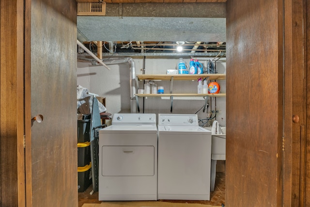laundry room featuring washer and dryer and laundry area