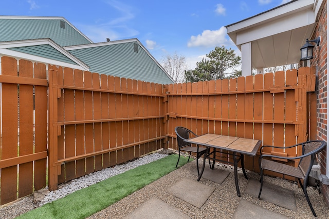 view of patio / terrace with a fenced backyard and outdoor dining area