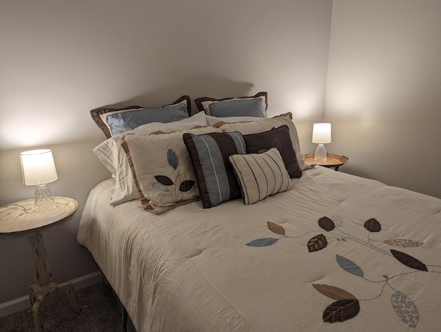 bedroom featuring baseboards and carpet floors