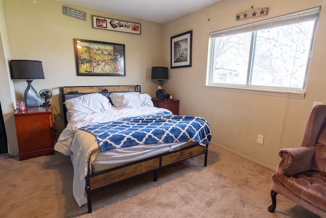 carpeted bedroom with baseboards