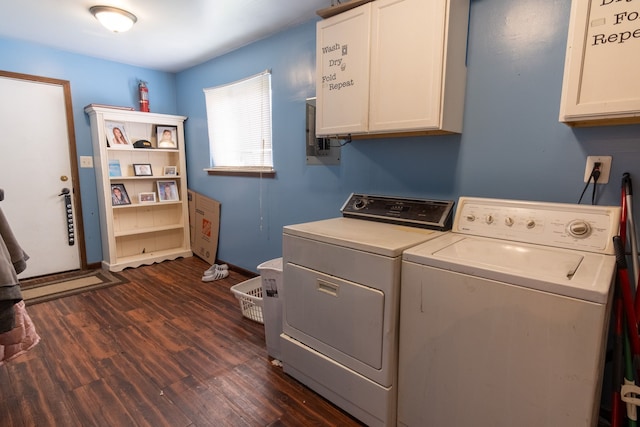 clothes washing area featuring washing machine and clothes dryer, baseboards, dark wood-style floors, and cabinet space