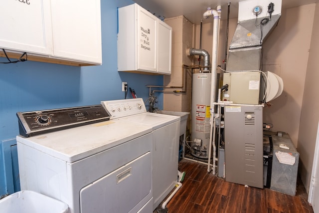 laundry room with cabinet space, water heater, independent washer and dryer, and dark wood-style flooring