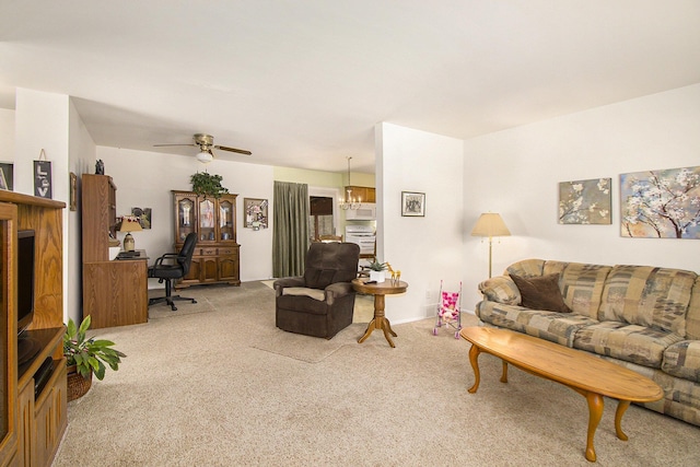 living room with light colored carpet and ceiling fan with notable chandelier