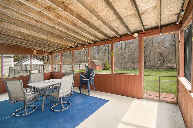 sunroom / solarium featuring outdoor dining area