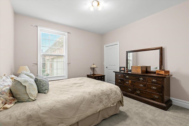 8427 Boulder Shores Dr, South Lyon, MI 48178 - bedroom featuring light colored carpet and baseboards