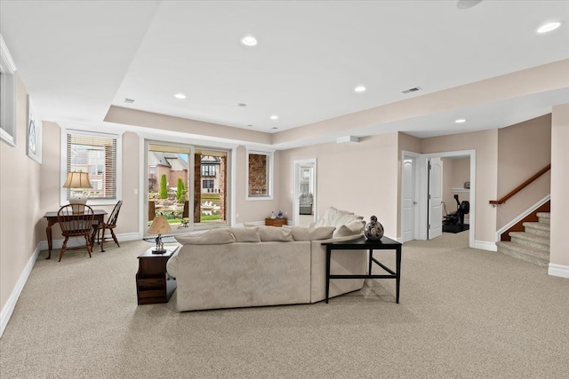 8427 Boulder Shores Dr, South Lyon, MI 48178 - living area featuring carpet flooring, baseboards, stairway, and recessed lighting