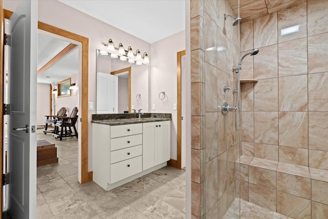 8427 Boulder Shores Dr, South Lyon, MI 48178 - full bathroom featuring a shower stall, vanity, and baseboards