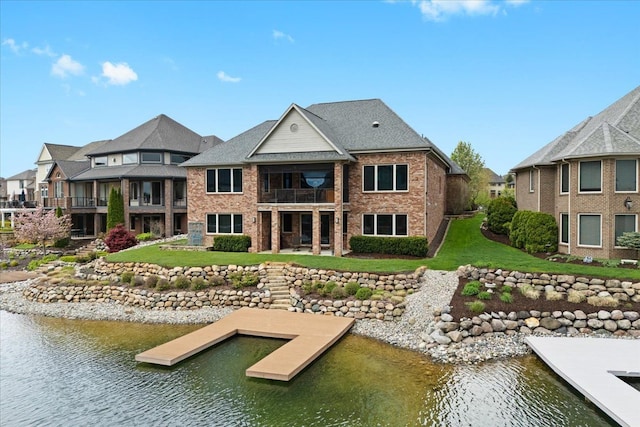 8427 Boulder Shores Dr, South Lyon, MI 48178 - back of property featuring a balcony, a water view, a yard, and brick siding
