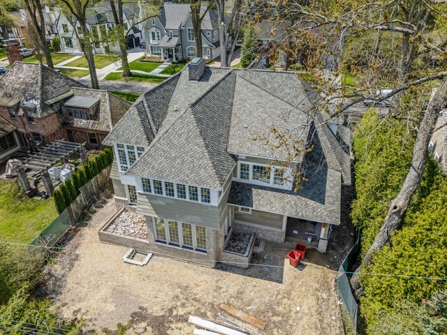 birds eye view of property with a residential view