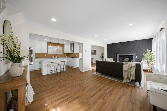 1525 Hiller Rd, West Bloomfield, MI 48324 - living room featuring recessed lighting, baseboards, wood finished floors, and a fireplace